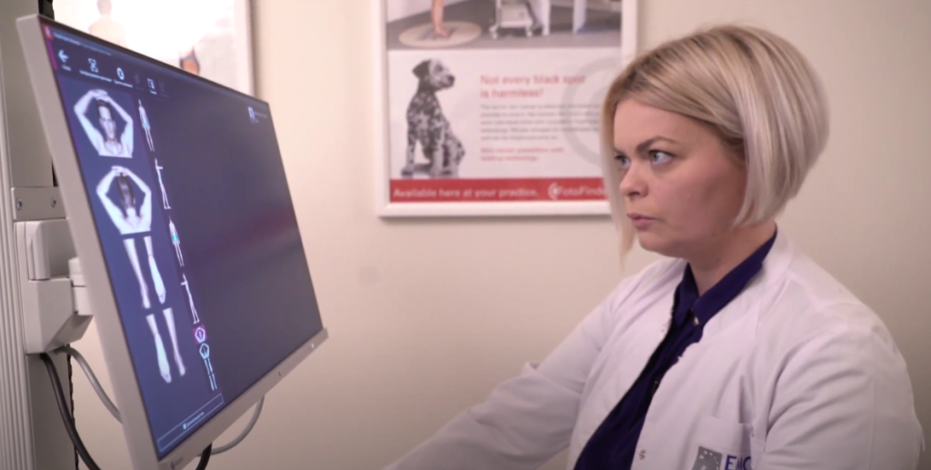 doctor performs diagnosis on FotoFinder